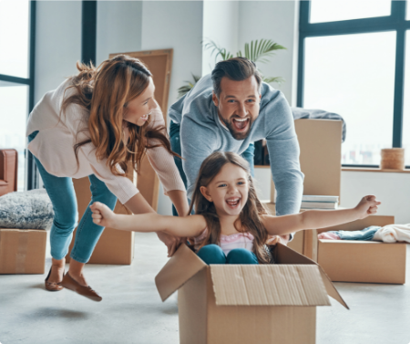 Parents playing with daughter in new home